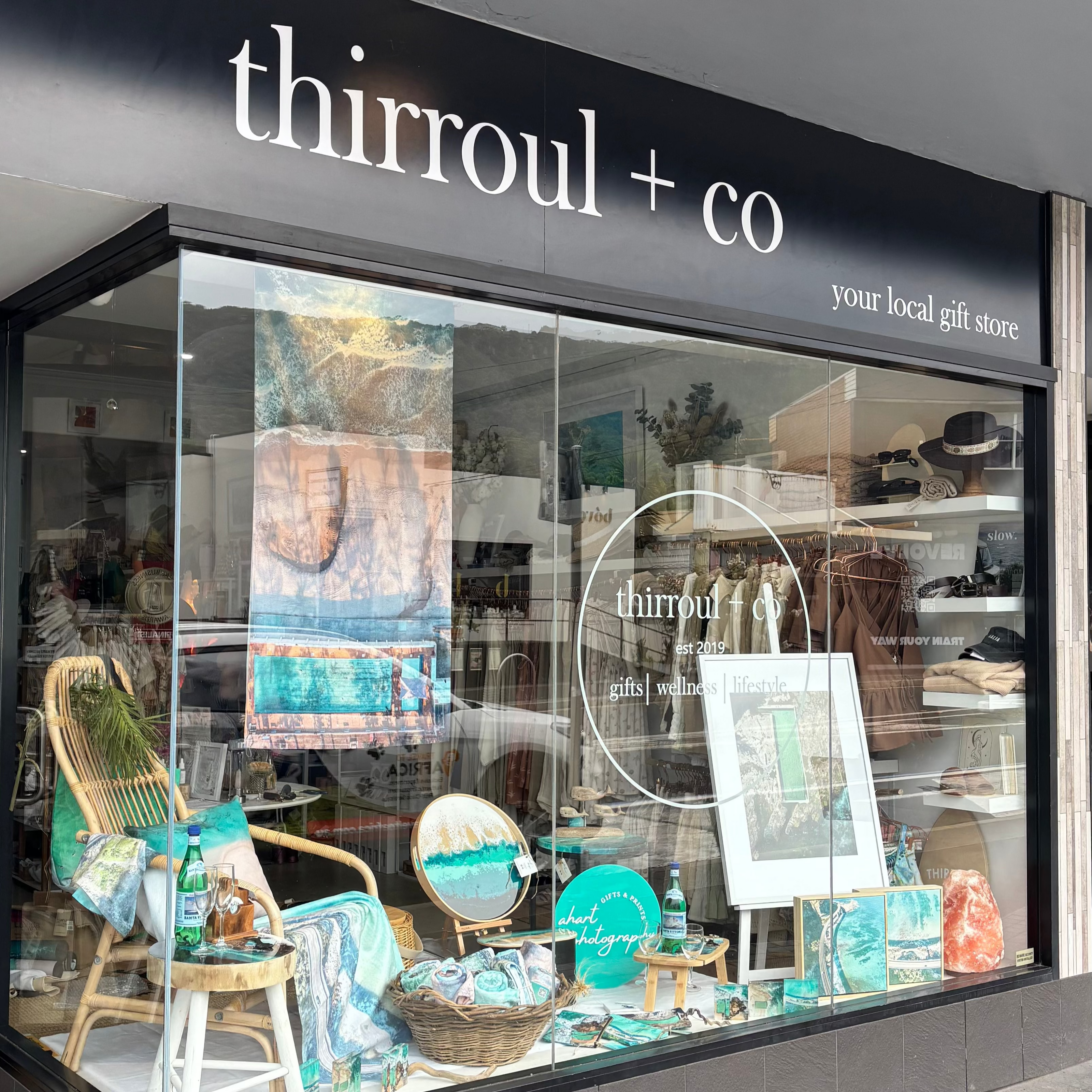 Storefront of thirroul + co with glass window display of AHart Photography products. Coastal decor and prints and gifts Illawarra NSW